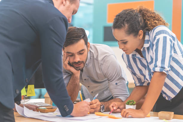 istock Team of young Architect Designer is brainstorming in office 1169169156