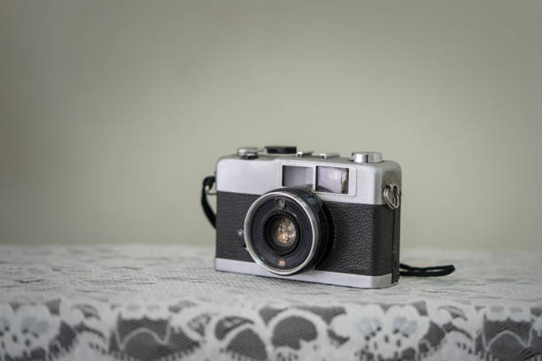 istock Vintage classic flim camera on white table 1169169691
