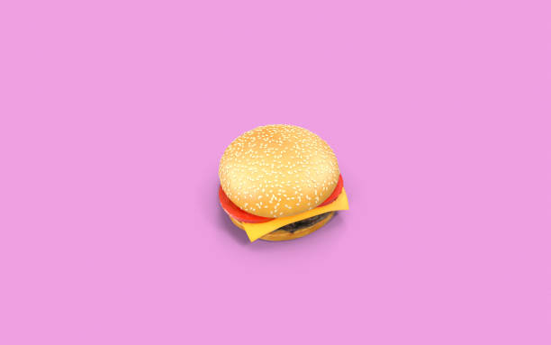 A small proportioned burger sits on a colorful plate held by a hand.