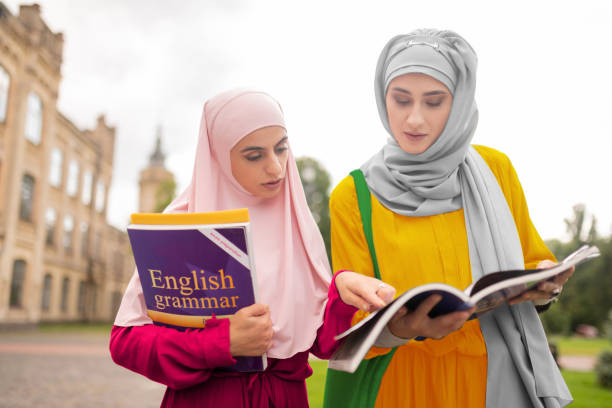 istock International students repeating English while walking to class 1169173204