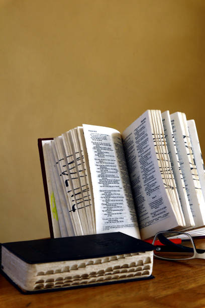 istock Holy Bibles on a table and eyeglasses 1169174223