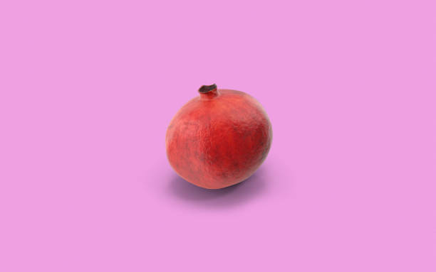 istock Pomegranate On Pink Background with Copy Space 1169174315