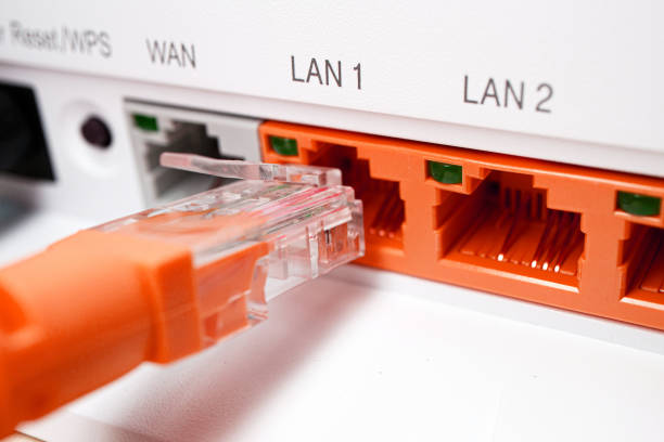 red patch cord utp 5e cable inserted into red free port, home router