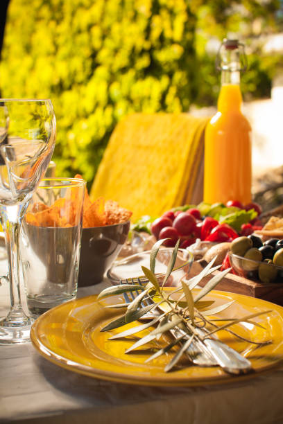 istock a plate for piquenique with fork, spoon and olive branch 1169175305