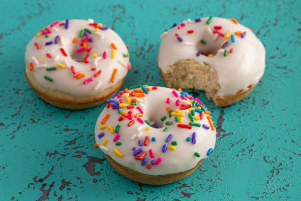 Cake Donut with White Frosting and Multicolored Sprinkles