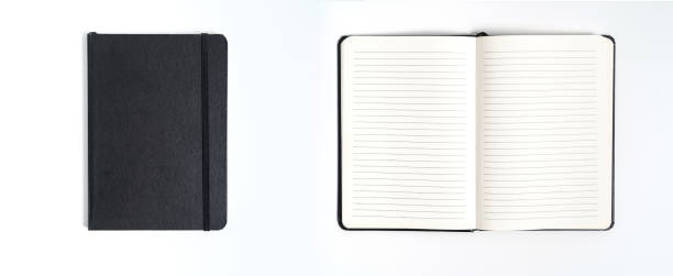 istock Notebook mock up with clean black blank for design and advertising. Notepad with chromed spring and free copy space template. On the gray background. 1169175710