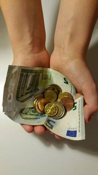 Euros in child's hands.