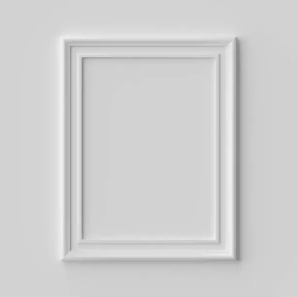 White blank vertical picture or photo frame on white wall with shadows, white colorless picture frame template, art frame mock-up 3D illustration