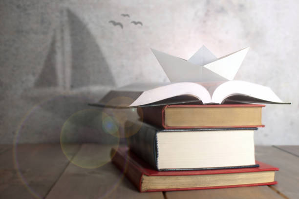 istock Paper boat, sail boat shadow, potential, dreams, growth 1169181110