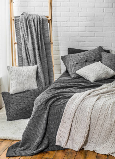 istock bedroom interior warm plaid pillows textile color 1169182570