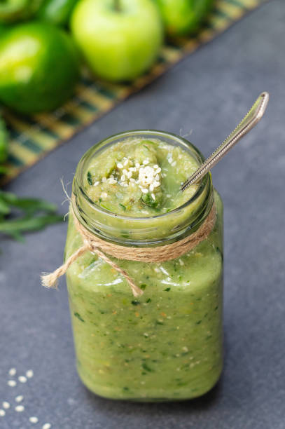 istock Vegetable green smoothie anh whole ingredients on a dark background 1169185777
