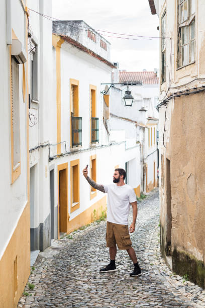 istock Casual brazilian young man video conferencing 1169189029