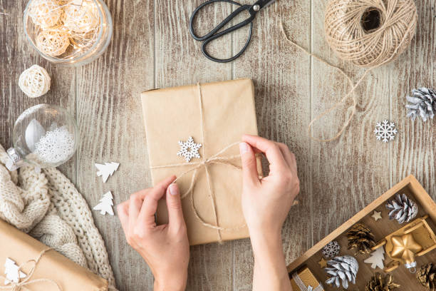 istock Christmas background with decorations and gift boxes on wooden table 1169194702