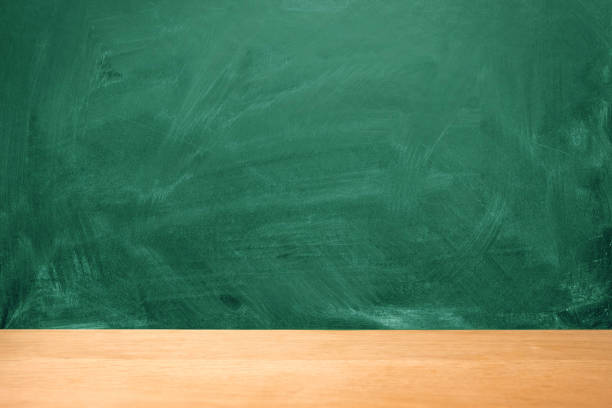 istock Green chalk board with chalk stains, selective focus, copy space 1169196027