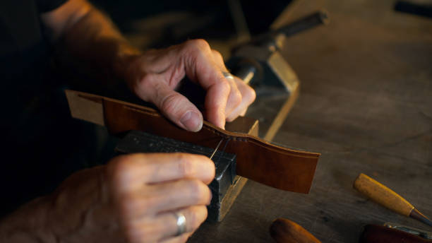 istock Craftsman holding crafting tool and working. 1169196974