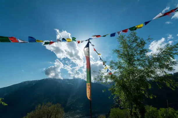 Photo of Budhist flags in the mountains near hamta