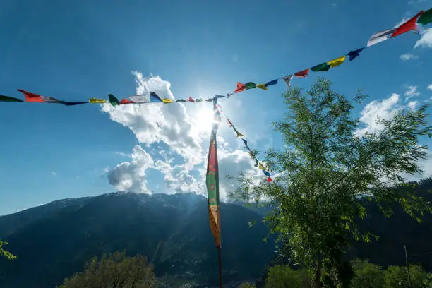 Photo of Budhist flags in the mountains near hamta