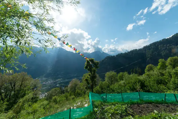 Photo of Budhist flags in the mountains near hamta