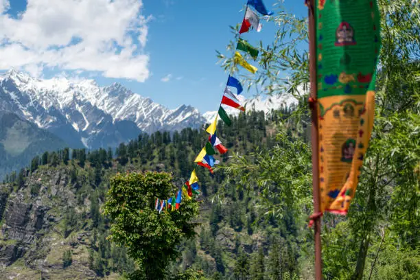 Photo of Budhist flags in the mountains near hamta