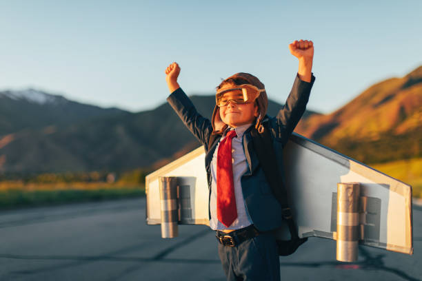 istock Young Boy Businessman Flying with Jet Pack on Skateboard 1169203411