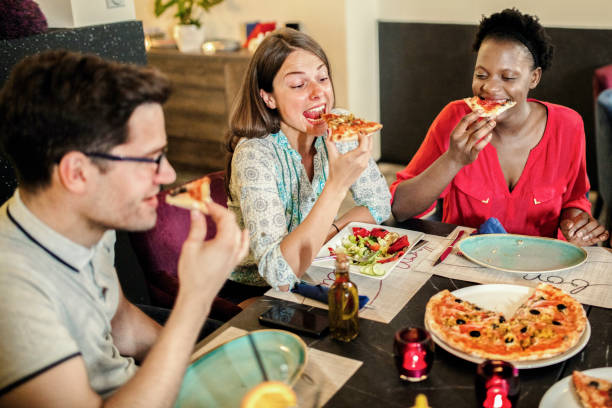 istock Friends Enjoying In Restaurant 1169203464