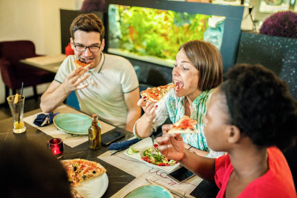 istock Friends Enjoying In Restaurant 1169203889