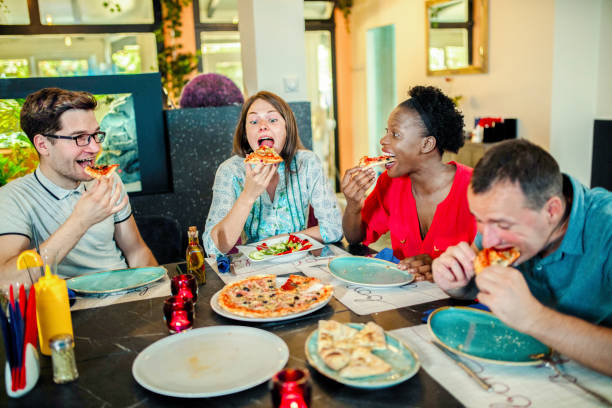 istock Friends Enjoying In Restaurant 1169203909