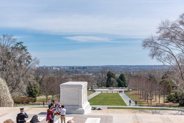 Changing of Guard Ceremony in Arlington National Cemetary during national cherry blossom festival, USA Tourists are watching the Changing of Guard Ceremony.
Arlington National Cemetery gravesite honoring the fallen in wars fought by Americans. arlington cemetery in spring stock pictures, royalty-free photos & images