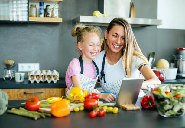 istock Happy family in the kitchen. 1169206297