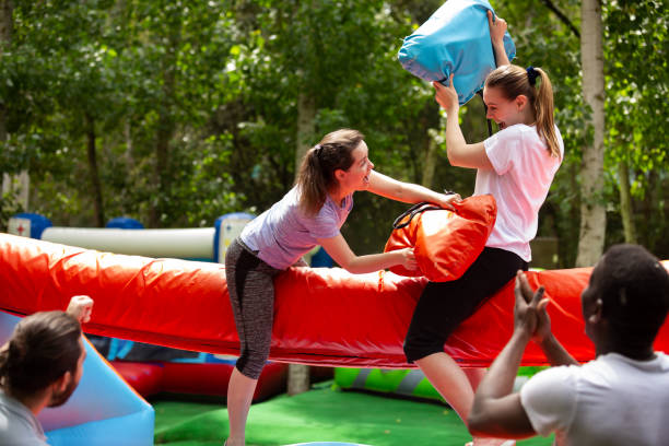istock Women on inflatable pillow fight arena 1169209493