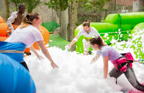 istock Team collecting balls in inflatable foam pool 1169209497