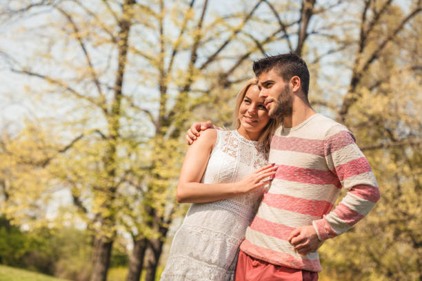 istock Happy couple looking away 1169211093