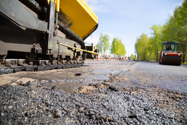 istock Repair of roads.  Laying asphalt using a roller. 1169214582