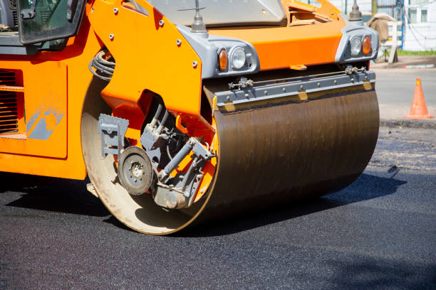istock Repair of roads.  Laying asphalt using a roller. 1169214640