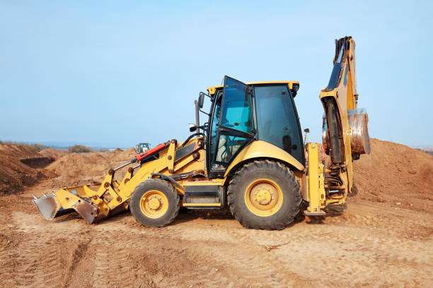 istock Excavator loader working at ground area, digging process. Yellow bucket. 1169216526
