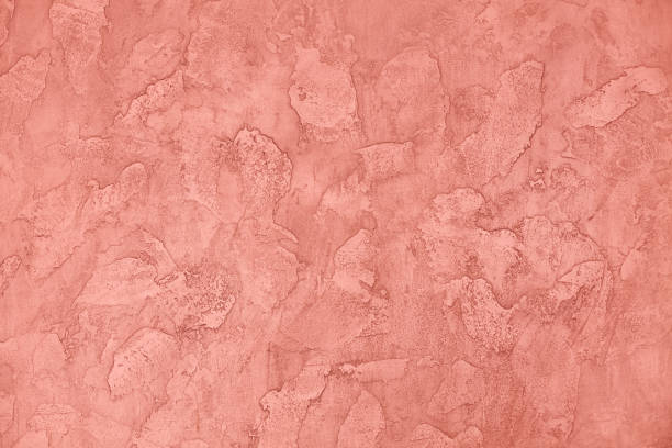 istock Living coral (vibrant) background - plastered wall. Copy space, for text or isolated. 1169218016