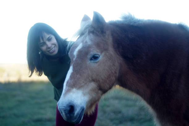 istock woman with horse 1169218017