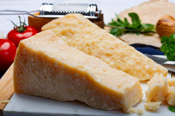istock Italian original aged Parmesan cheese in two pieces close up 1169224749