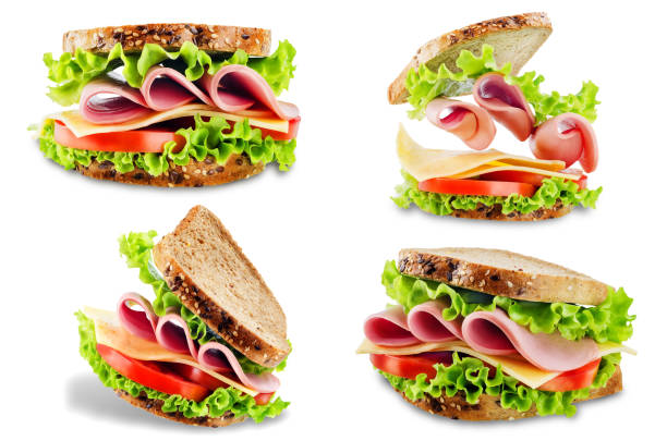 сэндвич с цельнозерновой хлеб, салат, сыр, помидоры и ветчина на белом изолированном фоне - bread isolated white portion стоковые фото и изображения