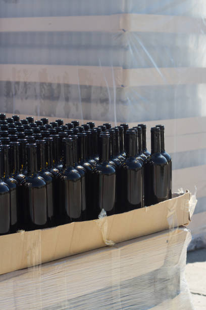 istock black wine bottles on pallets in outside storage area 1169228604