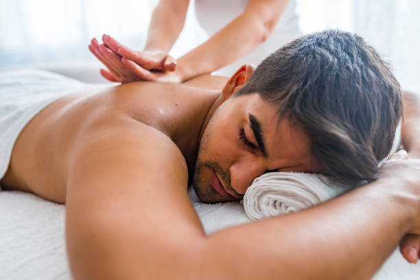 istock Young Man Enjoying Massage At Spa 1169228621