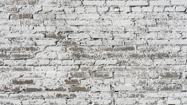 istock Empty Old Brick Wall Texture. Painted Distressed Wall Surface. Grungy Wide Brickwall. Shabby Building Facade With Damaged Plaster. 1169230333