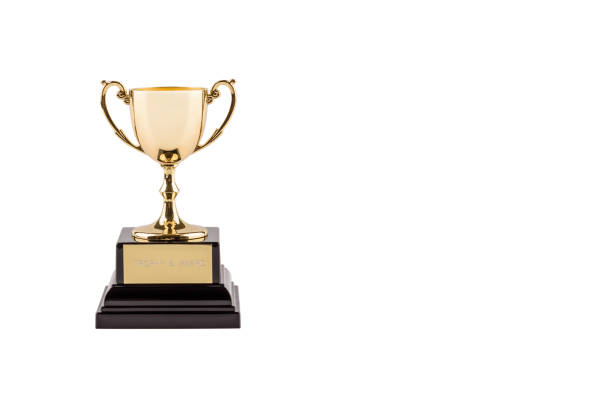 istock Brass steel trophy, dual handle neo-classic, isolated on white. Trophy is a tangible, durable reminder of a specific achievement, serves as recognition / evidence of merit, awarded for sporting events 1169230502