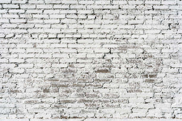 istock Empty Old Brick Wall Texture. Painted Distressed Wall Surface. Grungy Wide Brickwall. Shabby Building Facade With Damaged Plaster. 1169230531