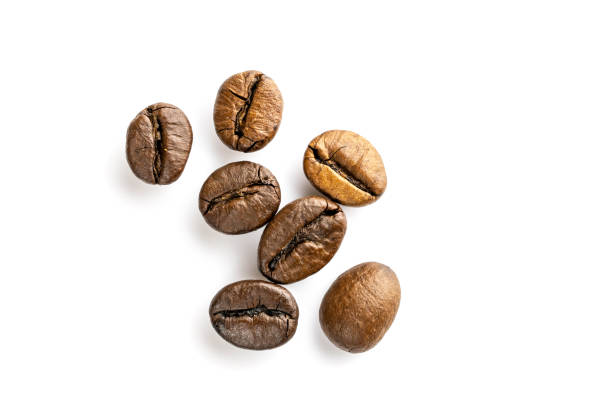 Roasted coffee beans for espresso, cappuccino on white background. Roasted coffee beans for espresso, cappuccino isolated in white background cutout. arabica coffee drink photos stock pictures, royalty-free photos & images