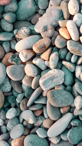 istock Abstract background of large pebbles lit by the sun 1169231502