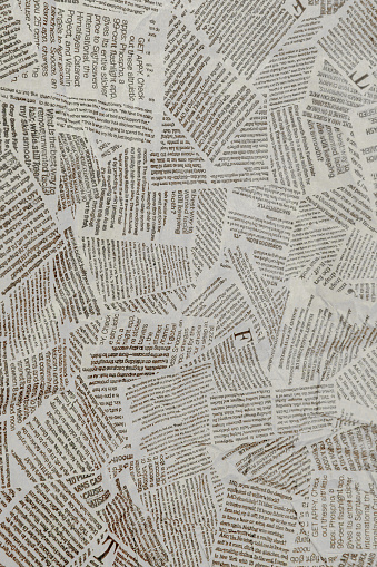 Black and white repeating torn newspaper background. Continuous pattern left, right, up and down.