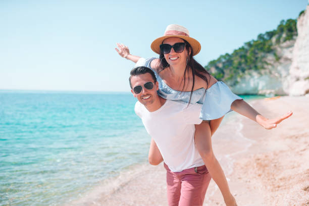 istock Young couple on white beach during summer vacation. 1169232794