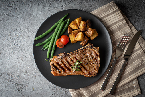 new york strip steak on concrete background