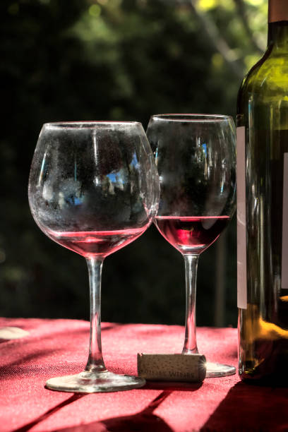 Glasses and bottle of red wine.